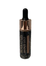 Iluminador líquido maquillaje Revolution a la sombra bronce dorado