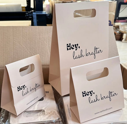 2025 Printed Pink Elegant Brand Logo Luxury Boutique Shopping Paper Bag Custom Logo White Paper Gift Bags