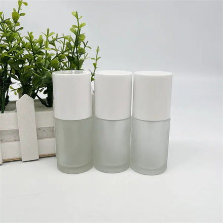 2022 New Design Frost Custom Cylinder Liquid Foundation Glass Liquid Foundation Bottle 30ml Skincare Lotion Bottle with Pump Cap