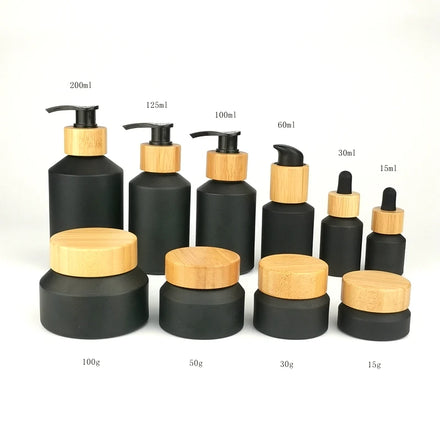Inclined Shoulder Matte Black Glass Bottle 30 ml 60 ml 100 ml Cosmetic Bottle and 15 gm 30 gm 50 gm Glass Jar with Bamboo Lid