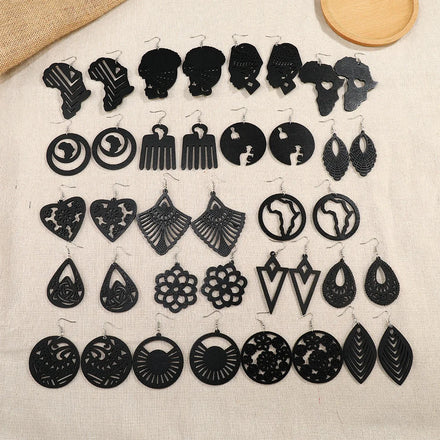 2023 Handmade Black Wooden Earrings New Design African Hollow Head Wooden Pendant Carved Earrings for Women