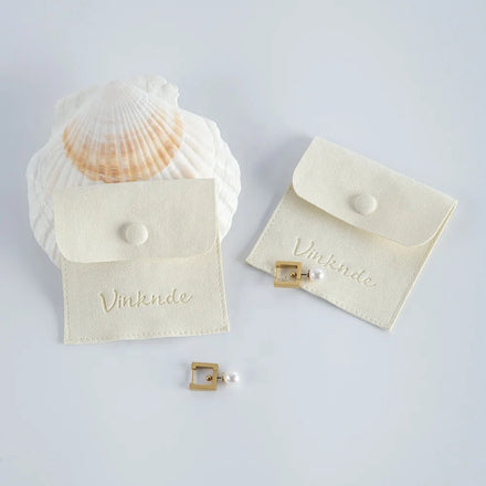 Custom 8x8 cm Ivory Suede Microfiber Luxury Jewelry Packaging Bag Pouch with Deboss Logo Fashionable Gift for Women and Girls