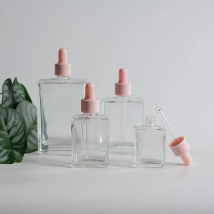 Wholesale 30ml 50ml 100ml Square Clear Glass Essential Oil Glass Dropper Bottle With Pink Lid for Cosmetic Packaging