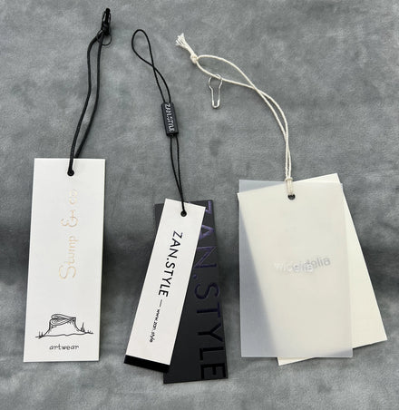 Custom Garment Hang Tags Eco Friendly Embossed Screen Printing Thick Cardboard Swing Paper Cotton String Clothing Care Bags