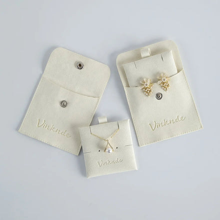Custom Logo Beige Ivory Luxury Beautiful Deboss Emboss Microfiber Earring Rings Bags Snap Pouch for Girl Women with Insert