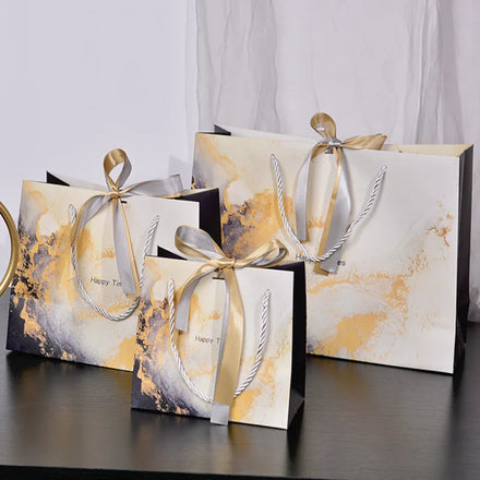 Factory Custom logo Gift Packaging Bag Clothes Branded Retail Shopping Paper Bags with Ribbon Handles