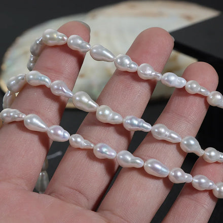 Wholesale Strong Light 5-6mm Water Droplets Size White Baroque Nucleus Irregular Fireball Shape Freshwater Pearl Beads Strands