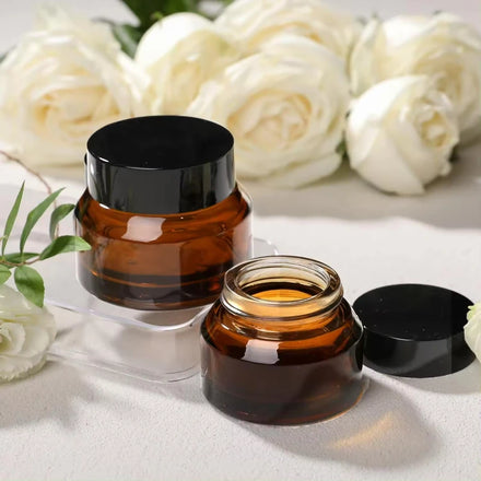 Eco-friendly Glass Cosmetic Jar 50ml Amber Packaging with Matte Black Gold Cap Custom Printing Plastic Option